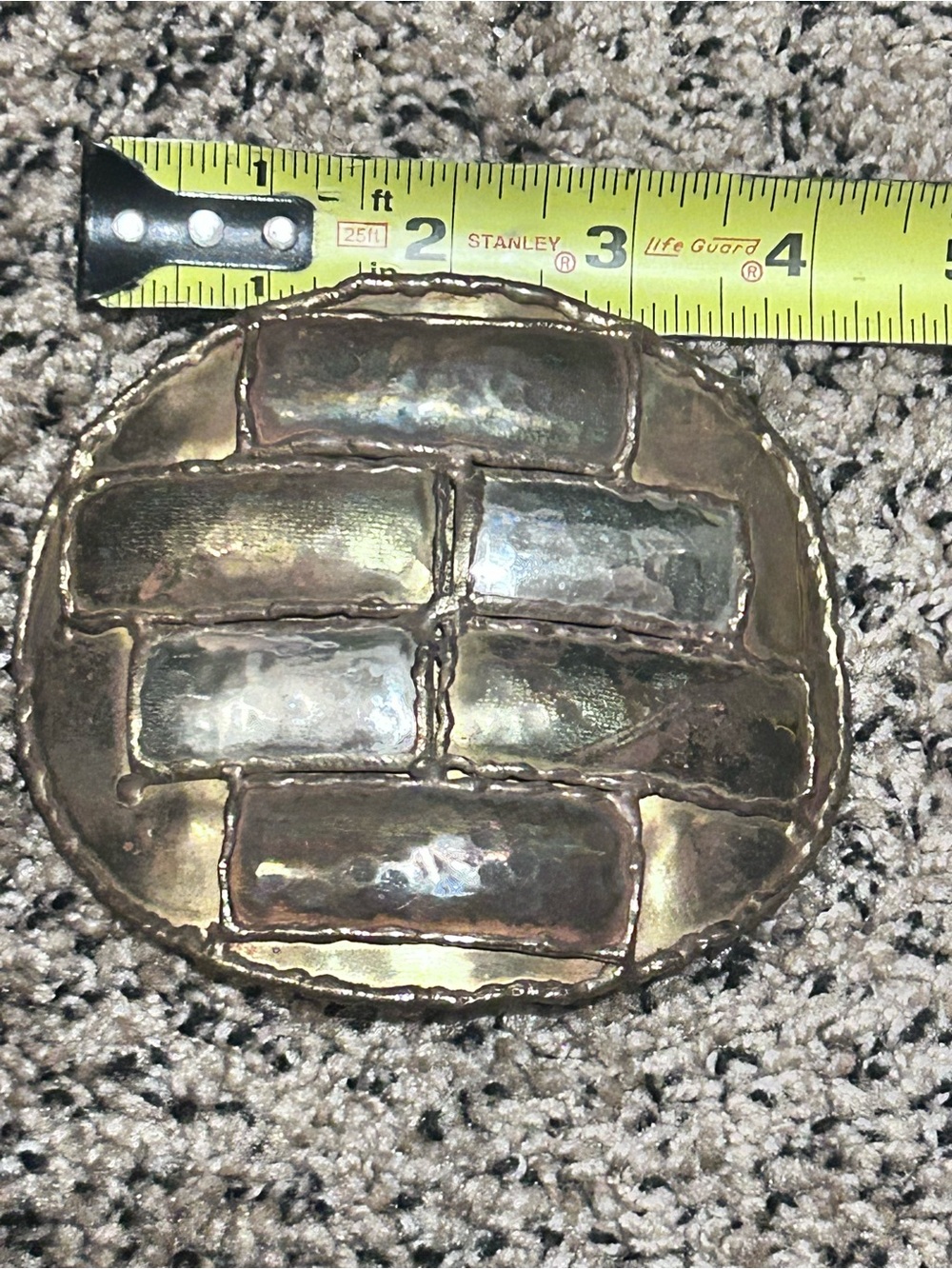 artisan-crafted vintage mixed-metal belt buckle features an abstract brick-